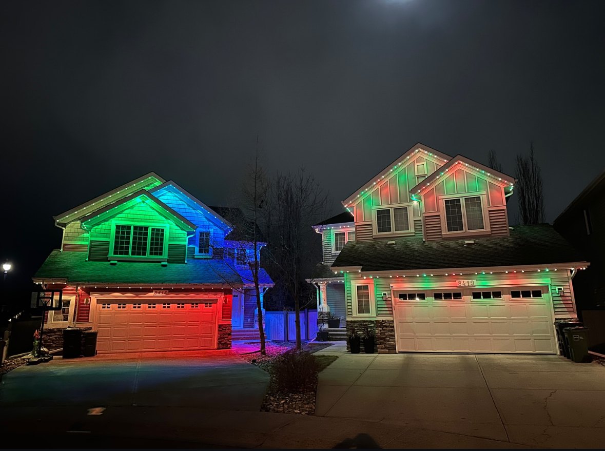 A home lit up with permanent exterior lighting at night, the kind of work Horizon did before it had a website or Google listing